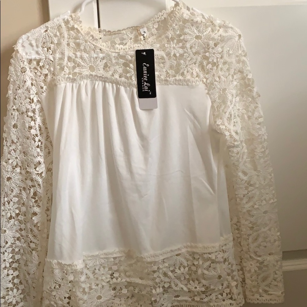 Long sleeve top with tags